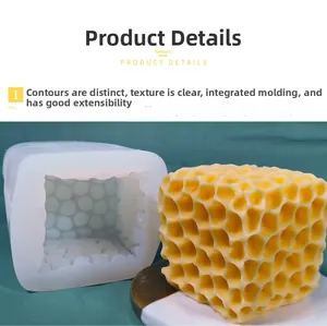 Detail of white silicone cube mold showing internal texture and finished honeycomb candle