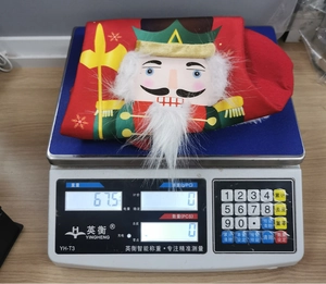 Detail shot of Nutcracker Christmas stocking weight measurement showing 67.5g total weight