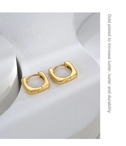 Detailed view of square gold-plated hoop earrings with polished finish and high luster