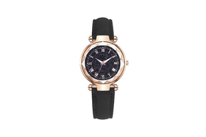 Macro view of blue starry watch dial with roman numerals and rose gold case detail