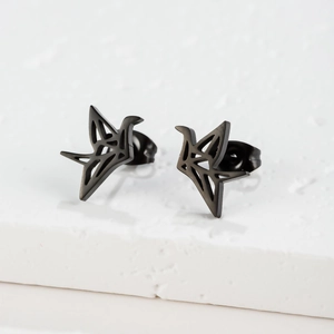 Macro shot of minimalist hollow crane stud earrings in black stainless steel finish