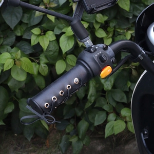 Vintage black leather motorcycle handlebar cover with lace-up detail for retro electric bikes