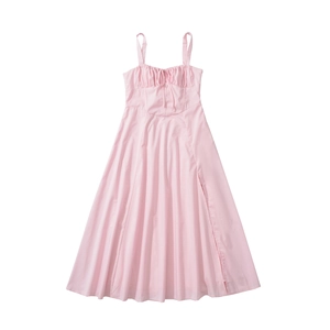 Detail view of pink vintage dress showing the ruched bodice, lace-up front, and slit skirt