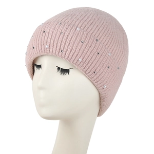 Pink knitted beanie for women with elegant pearls and small rhinestones on white head form