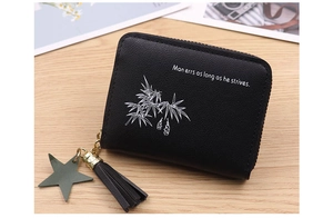 Detail of mini black PU leather coin purse with star charm and tassel zipper pull