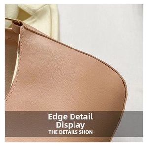 Macro detail of high-quality stitching and golden zipper on the light pink handbag