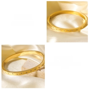 Dettaglio macro del bracciale in acciaio inossidabile 18K con stelle e zirconi incastonati
