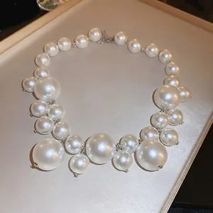 Exaggerated pearl necklace featuring multi-layered ivory beads in luxury Y2K style