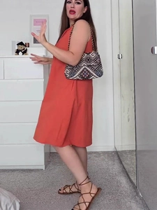 Elegant orange-red sleeveless V-neck midi dress with a loose A-line pleated silhouette