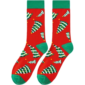 Detail of red Christmas socks with green heels and festive yellow star tree patterns