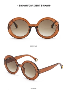 Detail of round frame sunglasses in gradient brown lens and high-quality frames