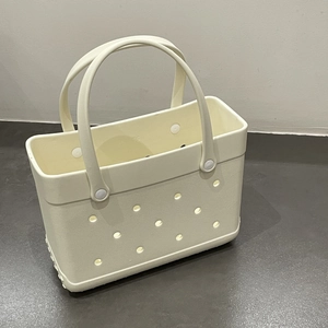 Detailed top view of off-white EVA beach bag featuring circular ventilation holes