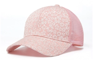 Detail of pink floral lace patterns and breathable mesh on a summer baseball cap