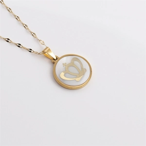 3D gold stainless steel necklace with crown pendant on white shell surface