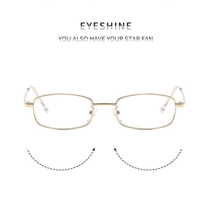 Close-up of minimalist metal frame glasses with adjustable nose pads and clear tips