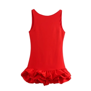 Detail of red sleeveless mini dress featuring multilayered ruffled hem and slim fit cut