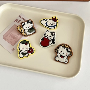 Detailed embroidery patches of five white cartoon cats with food and music accessories