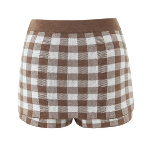 Close-up of high-waisted knit shorts featuring a brown and white checkered pattern design
