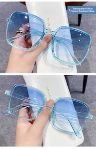 Detail view of transparent blue square sunglasses with gradient blue lenses and serial number