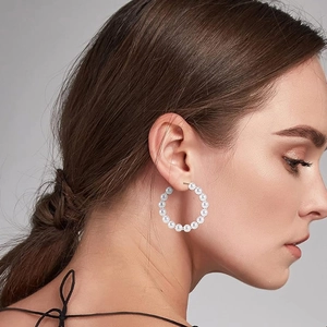 Elegant white pearl hoop earring for women shown on a model for size and fit guide