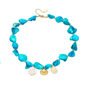 Exaggerated turquoise bead necklace with gold shell charms and stainless steel clasp