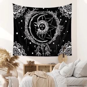 Detail of celestial sun and moon tapestry with boho dreamcatcher patterns for bedroom wall