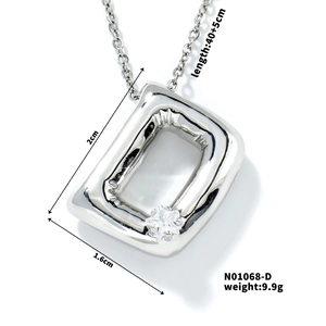 Macro shot showing dimensions of silver balloon letter D pendant necklace with zircon