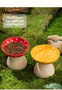 Macro detail of ceramic mushroom pet bowls with white dots on natural moss background