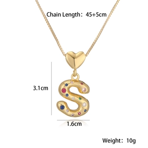 Macro shot of 18K gold letter S pendant with colorful crystals and dimensions details