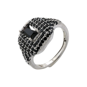 Macro shot of silver adjustable ring featuring large rectangle black gem and pavé setting