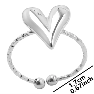 Macro detail of silver adjustable heart ring with hammered texture and 1.7cm diameter size