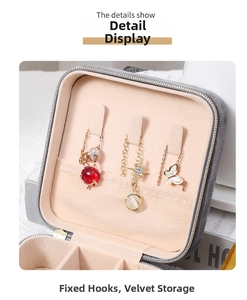 Close-up of velvet jewelry box featuring fixed necklace hooks and soft flannel storage compartment