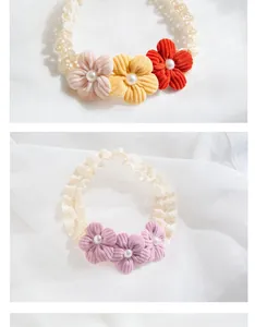 Detailed macro view of handmade corduroy flower headbands with faux pearls and lace