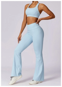Side view of light blue yoga set featuring a tight sports bra and flare pants
