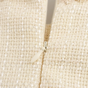 Chic cream tweed dress with round neck featuring a high-quality matching invisible zipper