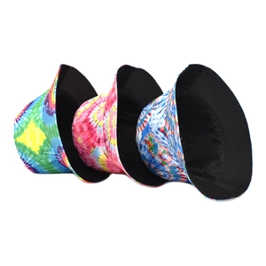 Three reversible rainbow tie-dye bucket hats with a flat top design on white background