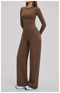 Detail of high-stretch brown yoga set with long sleeve top and wide leg pants