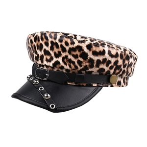 Leopard print newsboy cap with black faux leather brim and rivet buckle strap detail