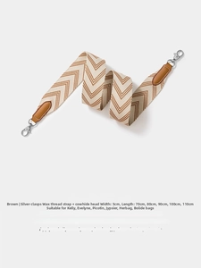 Close-up of 5cm wide brown and white herringbone woven strap with leather ends