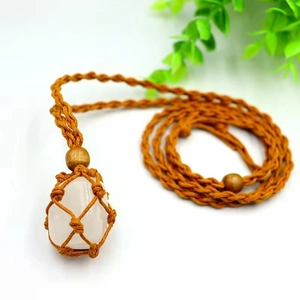 Handcrafted woven net pouch necklace with a natural white crystal stone and wood beads