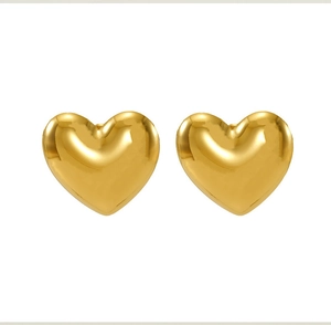 Macro shot of polished 18k gold-plated heart stud earrings with a glossy mirror finish