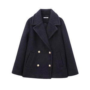Double-breasted navy wool coat for women with classic gold buttons in a loose fit style