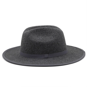 Detail of a dark grey flat brim fedora hat featuring high quality wool felt texture