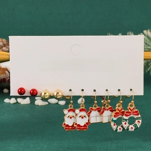 Detail showing 5 pairs of festive Christmas earrings including Santa Claus and wreaths