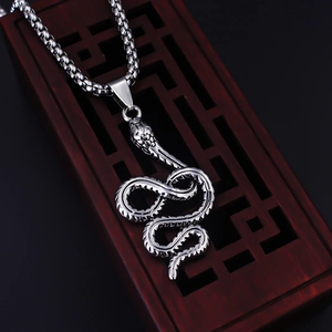 Vintage stainless steel snake pendant necklace with detailed texture on a box chain