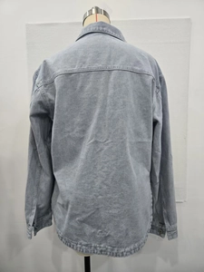 Detail view of the back of a vintage oversized denim jacket with structural seams