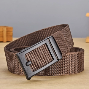 Macro shot of dark brown nylon woven belt with a sleek matte black buckle for men