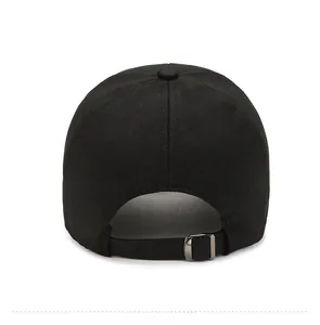 Detail view of the back of a black baseball cap with adjustable metal buckle and textured fabric