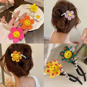Colorful floral smiley hair clip with rhinestones shown in various angles and on hair