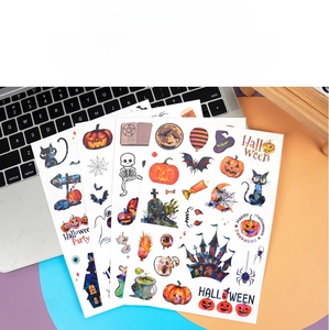 Detail of holographic Halloween stickers featuring glowing pumpkin and ghost patterns